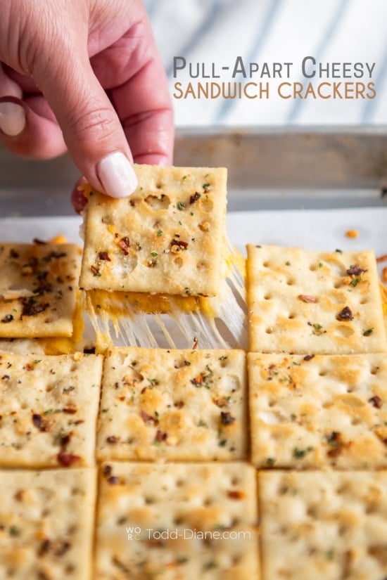 holding pull apart cheese sandwich cracker 