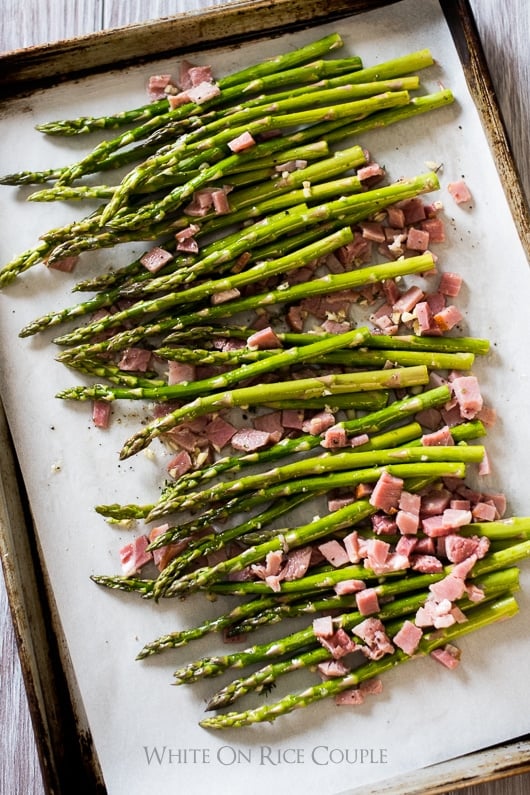 Garlic Roasted Asparagus Recipe with Ham on a baking sheet