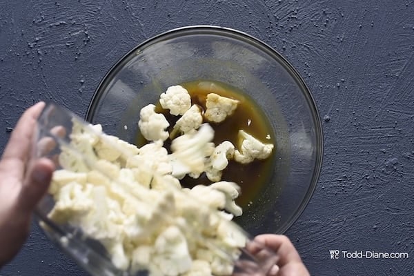 Adding cauliflower to marinade