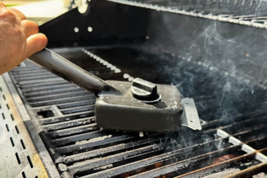 Scraping grill clean