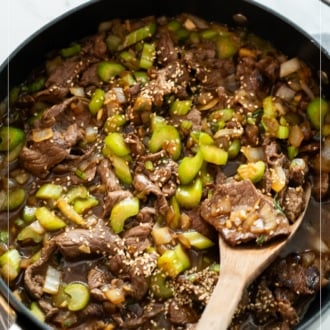 spoon in pot of sesame beef celery stir fry