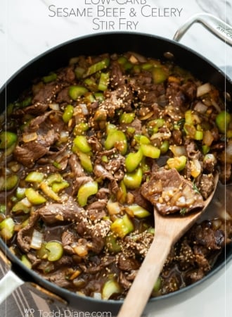spoon in pot of sesame beef celery stir fry