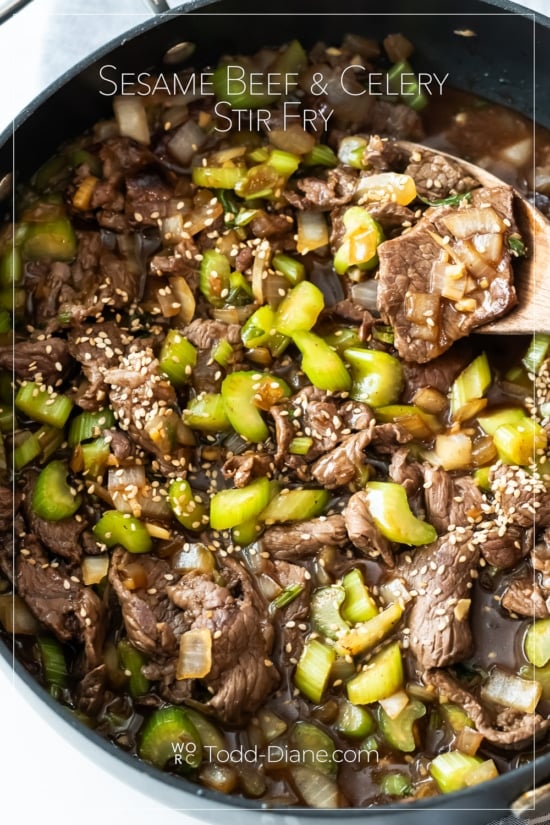 spooning sesame beef and celery stir fry