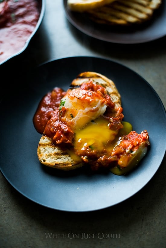 Poached Eggs in Tomato Sauce Shakshuka or Shakshouka toast on a plate