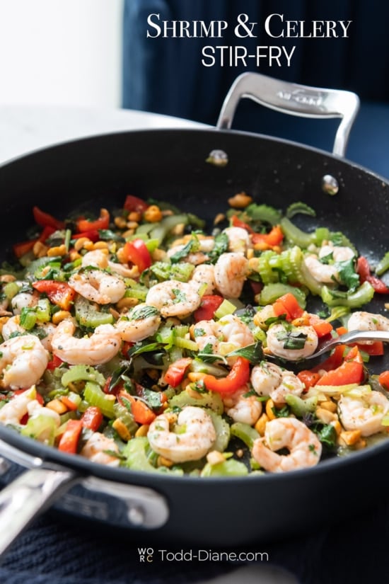 celery and shrimp stir fry in pan 