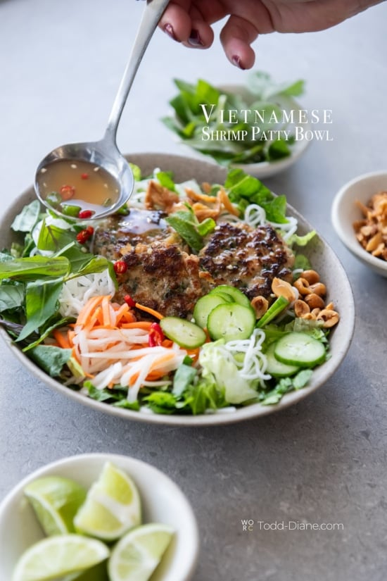 saucing vietnamese shrimp patty noodle bowl