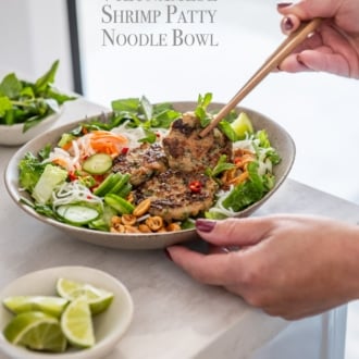 chopsticks eating vietnamese shrimp patty noodle bowl