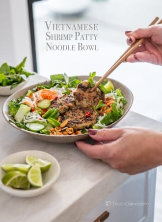 chopsticks eating vietnamese shrimp patty noodle bowl