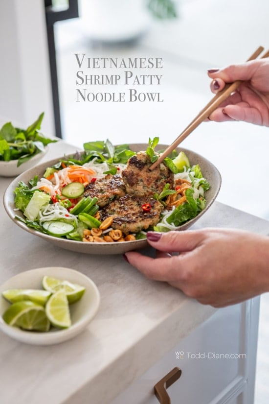 chopsticks eating vietnamese shrimp patty noodle bowl