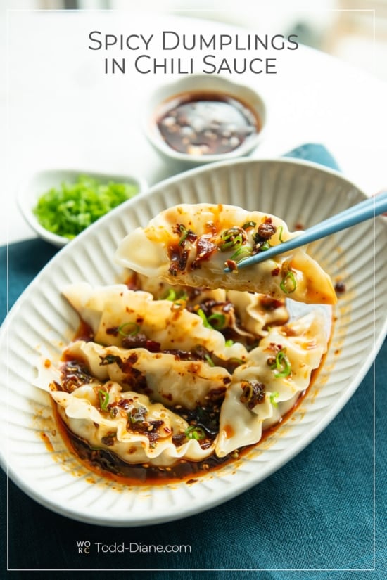 chopstick holding spicy dumpling