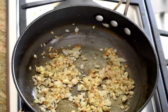 Garlic and shallots cooking in a pan