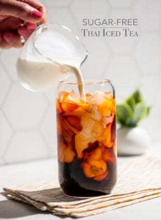 pouring cream into sugar free thai iced tea