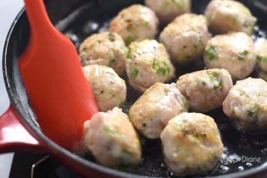 Browning meatballs on a skillet