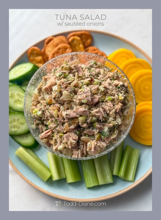 bowl of tuna salad with onions and vegetables 