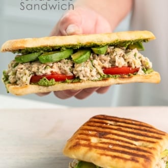 holding tunacado sandwich