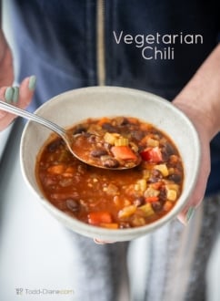 vegetarian chili recipe holding bowl