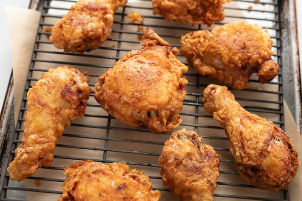 Finished fried chicken on cooling rack