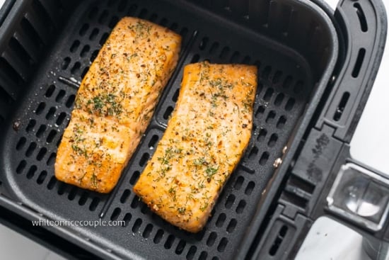 Air fried garlic herb salmon in air fryer basket