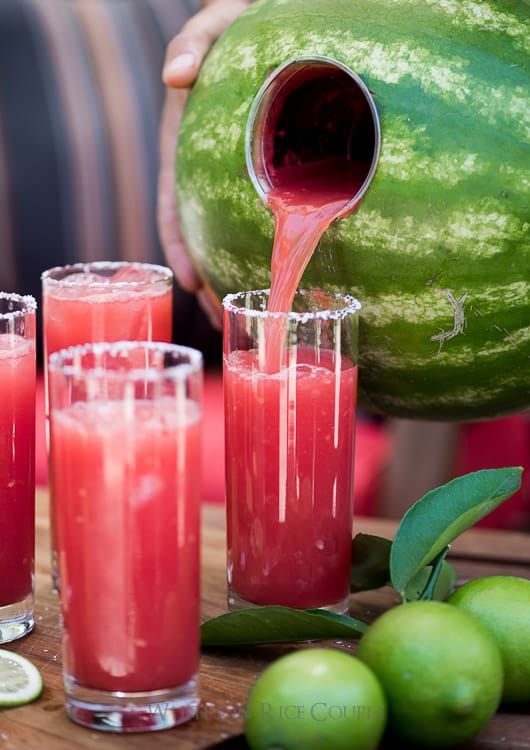 Watermelon Margaritas pouring into glass