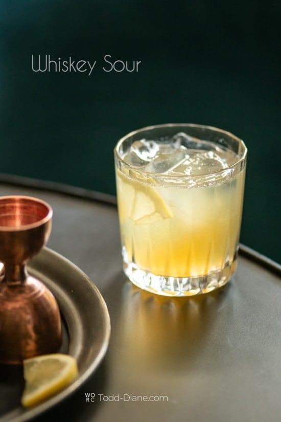 whiskey sour cocktail on bar table