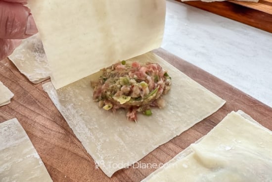 Placing top wrapper on wontons