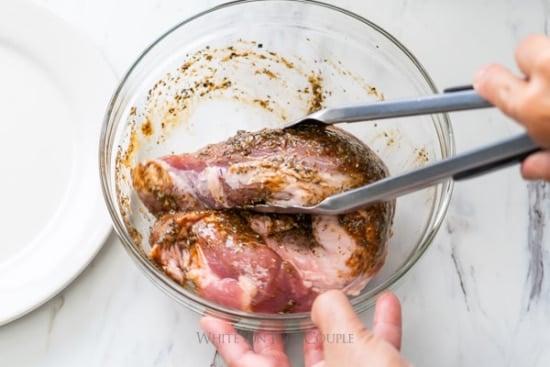Tossing pork tenderloin with marinade