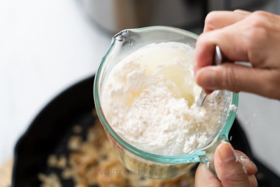 Whisking together flour and broth