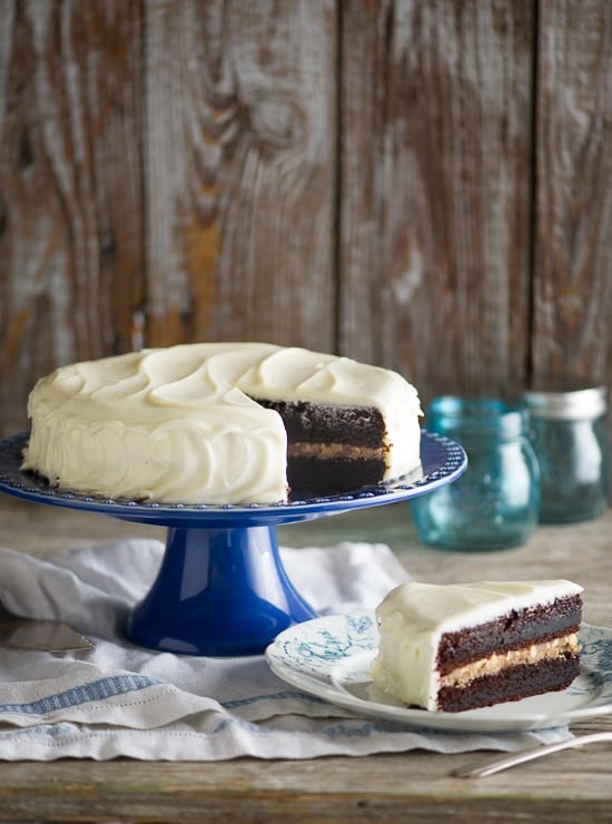 Super moist Chocolate Black Magic Cake with Cream Cheese Frosting on a cake stand