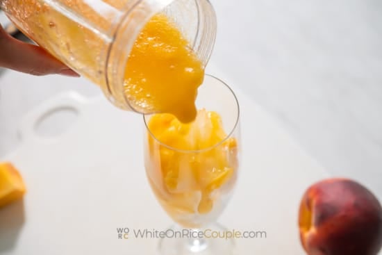 Pouring peach mix over ice