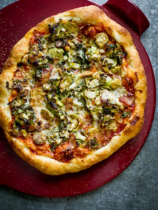 Brussels Sprouts, Bacon and Parmesan Pizza on a cutting board