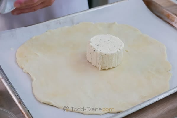 round of cheese in center of pie dough