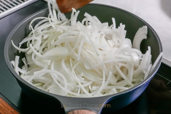 cooking raw onions in pan