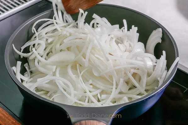 cooking raw onions in pan