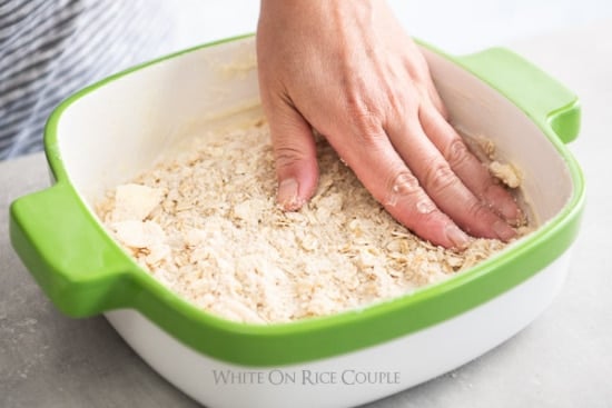 Pressing the crust into the baking dish