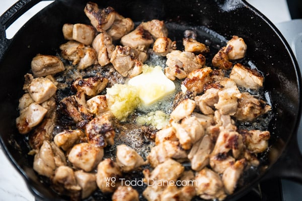 adding butter and garlic