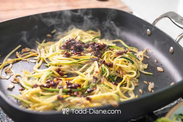 adding chili crunch to noodles