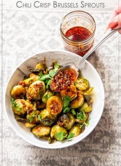 chili crisp brussels sprouts with spoonful of chili crunch