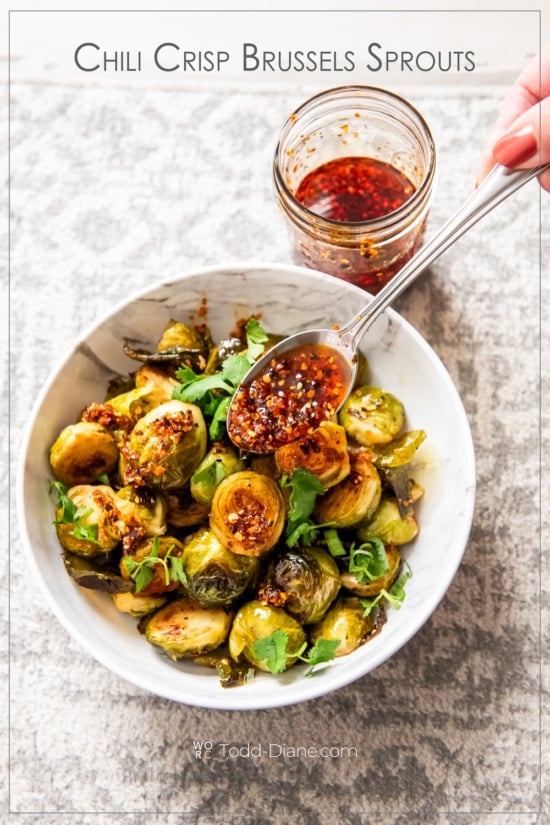 chili crisp brussels sprouts with spoonful of chili crunch 