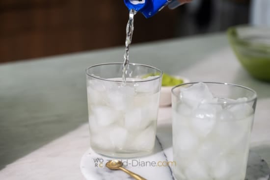 pouring coconut water over ice