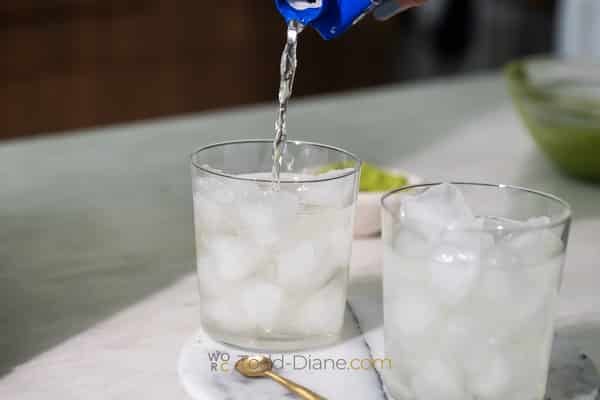 pouring coconut water over ice