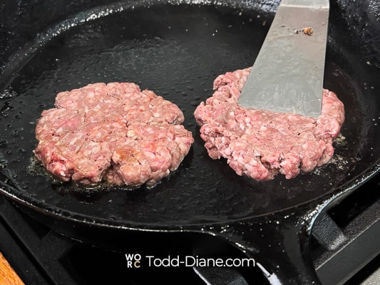 smashing the burger patties
