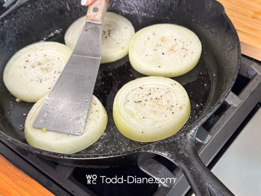 cooking raw onion slices