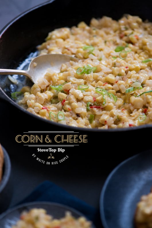 Corn and Cheese Stovetop Dip in a skillet with a spoon