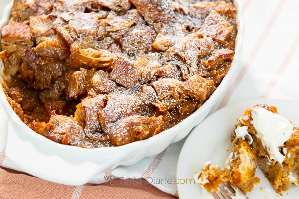 dusting of powdered sugar over bread pudding