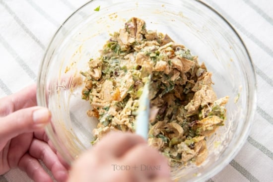 Stirring together the curry chicken salad