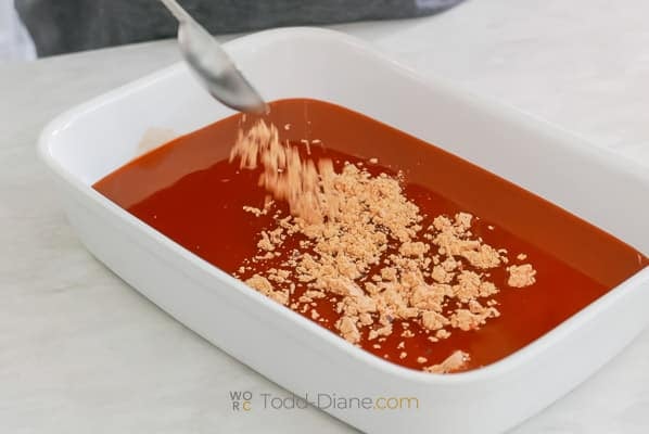 adding taco seasoning to enchilada sauce