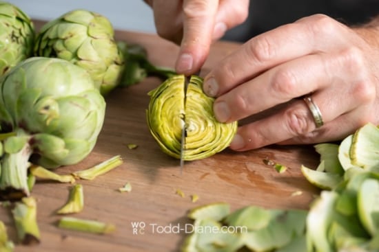 cutting artichoke in half