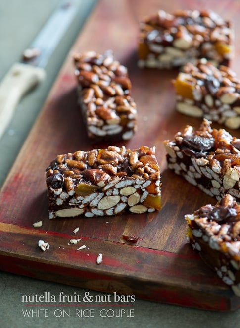 No Bake Energy Bars Recipe with Nutella, Dried Fruit and Nuts on a cutting board
