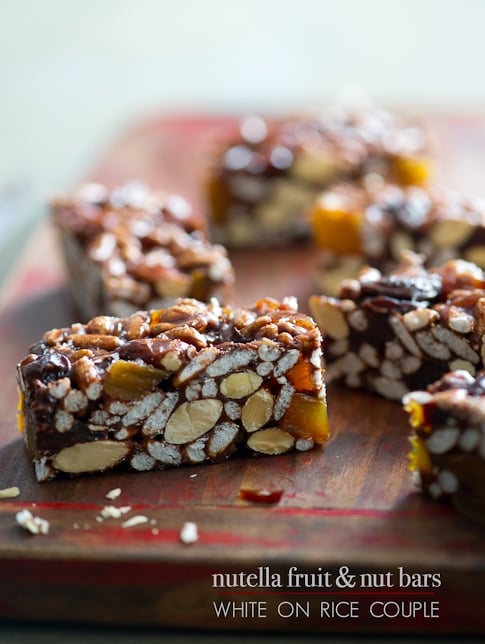 No Bake Energy Bars Recipe with Nutella, Dried Fruit and Nuts on a cutting board close up