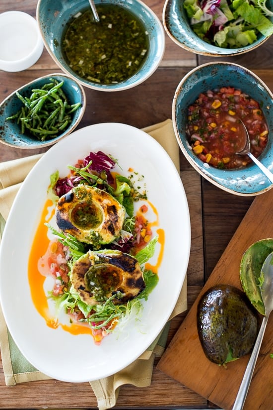 Grilled Avocado Salad with Corn Pico De Gallo and Chimicurri Dressing on a plate